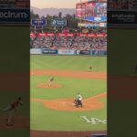 Shohei Ohtani batting while a kid in the crowd sings him a song he wrote for him.